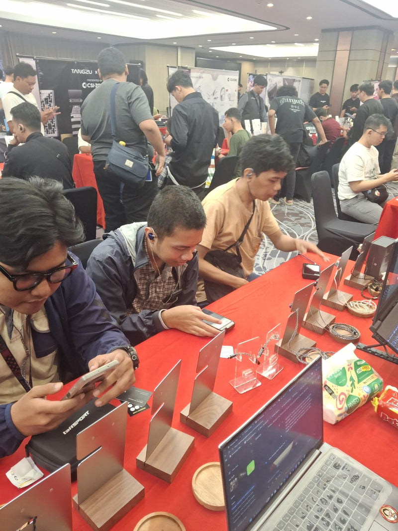 Visitors trying BQEYZ earphones at an audio exhibition, January 2026